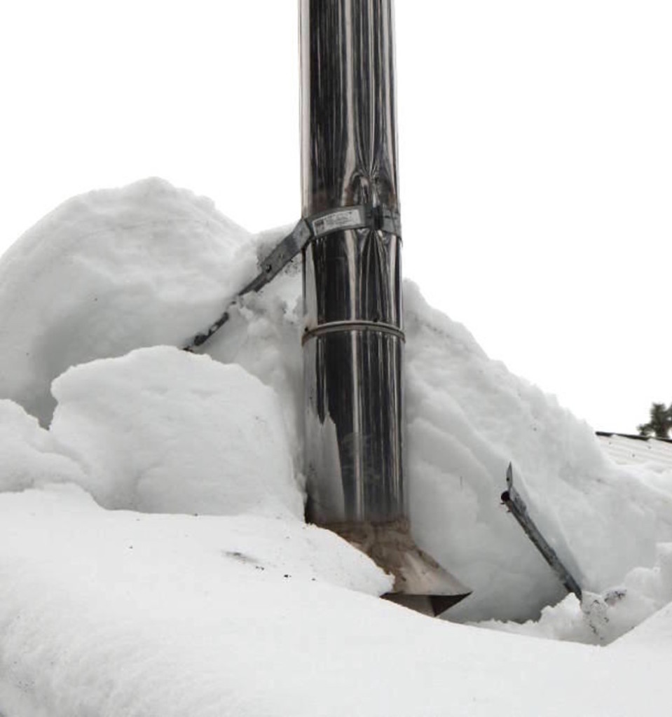 Broken damaged chimney pipe from snow load