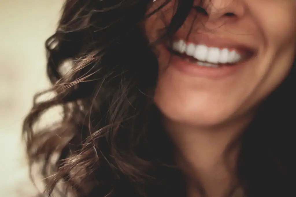 woman smiling showing teeth